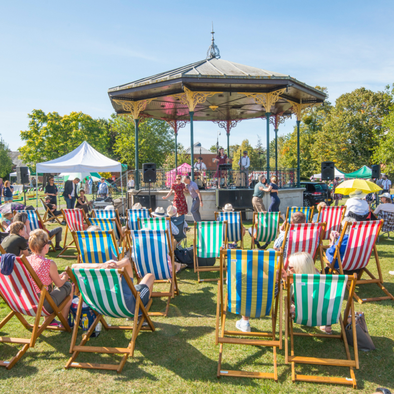 Photograph of deck chairs in a park