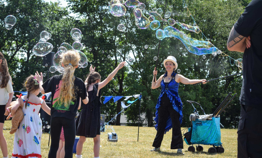 Photograph of children playing with bubbles
